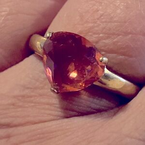 A stunning and unique rounded triangle ring in coral. AAA quality cubic